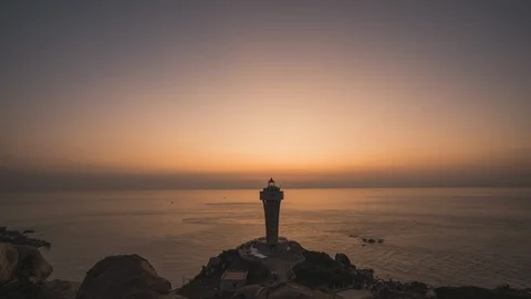Time-lapse seaside lighthouse sunrise Stock Footage