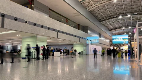 Time lapse of security checkpoint on left and passengers in departure hall Stock Footage 301538874