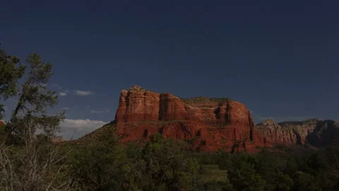 Time lapse of Sedona red rocks in the moonlight with clouds and stars above Stock Footage 159360309
