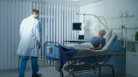 Time-Lapse of the Senior Patient Lying in Bed in the Hospital Geriatrics Ward. Stock Footage