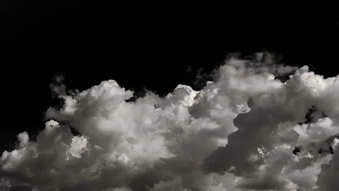 Time-lapse of separate white clouds on a black background have real clouds. Stock Footage 257683215