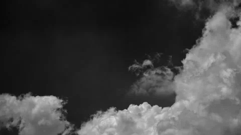 Time-lapse of separate white clouds on a black background has real clouds Stock Footage 307514310