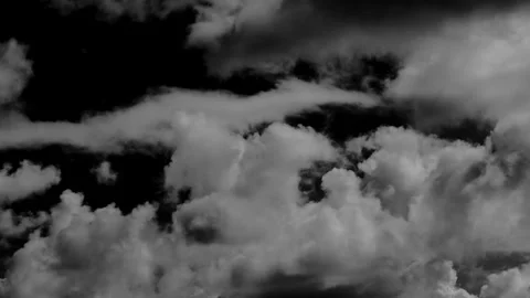 Time-lapse of separate white clouds on a black background has real clouds. .. Stock Footage 337332735