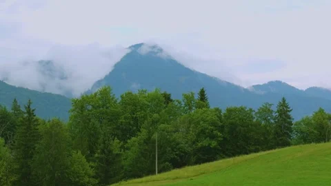 Time lapse sequence captures fog moving around a mountain in the Austrian Alps w Stock Footage 341737196