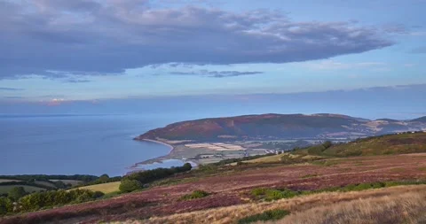 Time lapse sequence of farming land and coast line, Porlock, Wales, UK Stock Footage 264093620