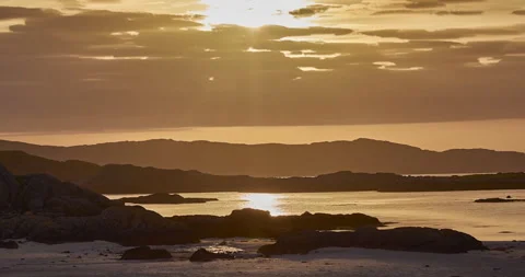 Time lapse sequence of setting sun behind clouds, Fidden Beach, Isle of Mull Stock Footage 264098602