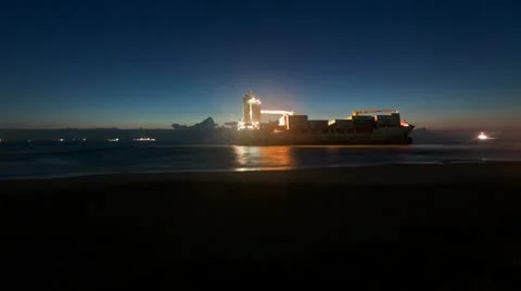 Time Lapse Sequence of Sunrise with Ships stranded off Spanish coast Stockbeeldmateriaal 12717272