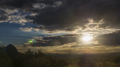 Time lapse of a serene sunset over desert mountains Stock Footage 79049904