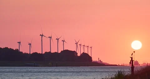 Time lapse of setting sun behind wind turbines, Rotterdam, Netherlands Stock Footage 264096758