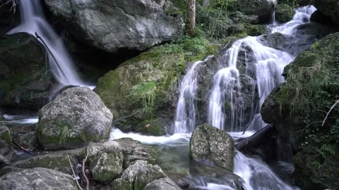 Time Lapse of several small waterfalls among the stones Stock Footage 121859213