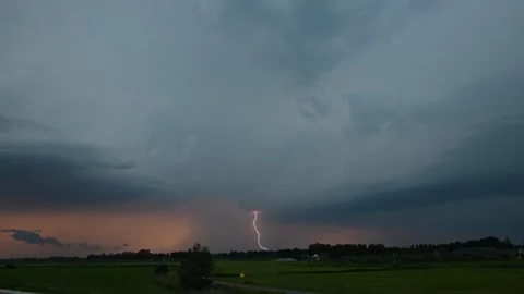 Time lapse of a severe lightning storm at sunset Stock Footage 338125970