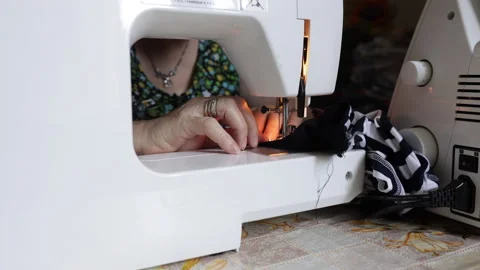 Time lapse: sewing machine on clothes and material. Tailor at work. Close up Video stock 135131953