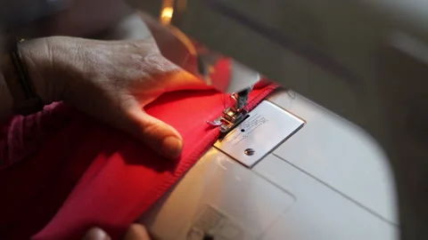 Time lapse: sewing machine on clothes and material. Tailor at work. Close up Video stock 135132656