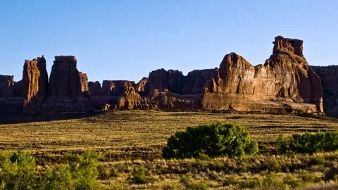 Time lapse of shadows creep across rock formations in Arches NP Stock Footage 79587988