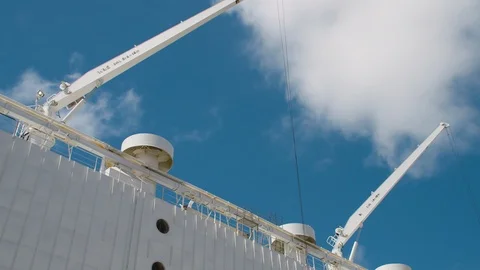 Time lapse of ship cranes against a brilliant blue sky - HD 30P. Stock Footage 87881277