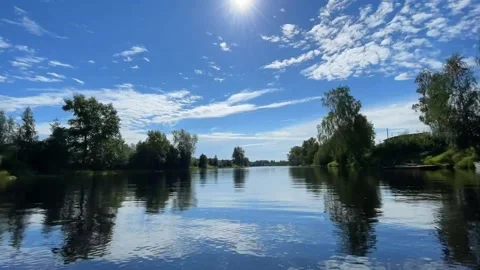 Time lapse. Shooting from a floating boat. Sun of day. Fast river and clouds Stock Footage 160400828