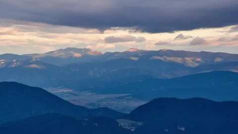 Time lapse shot of alpine mountains with fast moving clouds, mountain landscap Stock Footage 293778125