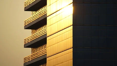 Time lapse shot of beautiful sunset reflected on office building window Stock Footage 74943422