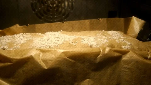 Time lapse shot of bread baked in oven at high temperature, dough rising Stock Footage 104130104