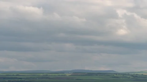 A time-lapse shot of a bright blue sky covered with large fluffy white cumulus Stock Footage 319762755