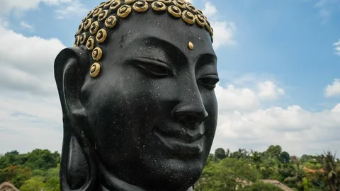 Time lapse shot of Buddha face, Buddha head sculpture. Stock Footage 86318447
