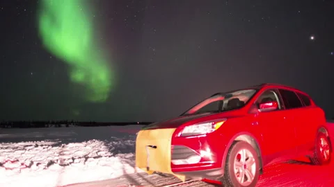 Time Lapse Shot Of Car Over Snowy Landscape While Northern Lights In Sky At Stock Footage 160314678