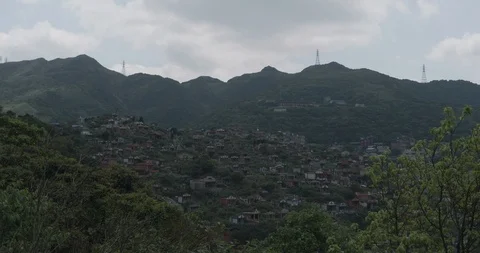 Time-lapse shot of cloud moving above Jiufen, also spelled Jioufen or Chiufen Stock Footage 89941471