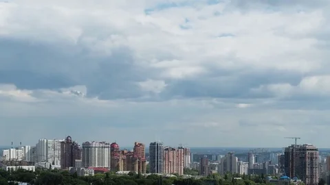 Time lapse shot of  clouds over the city. Panorama. 4K Stock Footage 77399355