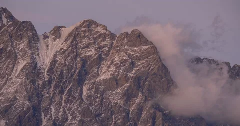 Time lapse shot of clouds running on blue sky over Shkhara glacier. 스톡 동영상 221301586