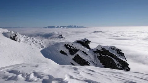 Time Lapse Shot of Clouds Under the Mountains Top in Winter During Sunny Day Video stock 71201719