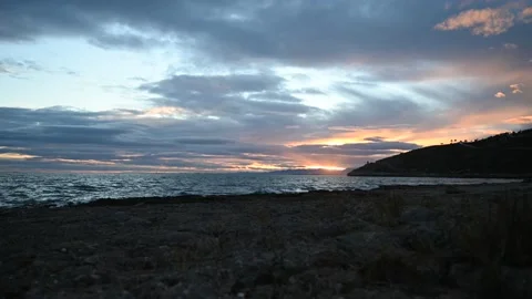 Time lapse shot of colorful clouds passing over Torre de la Corda in Oropesa Stock Footage 227706237