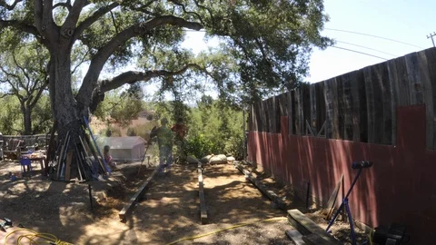 A time lapse shot of construction workers building a deck. Stock Footage 107556737