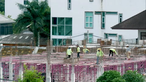 Time-lapse shot of construction workers building new construction. Stock Footage 220184600