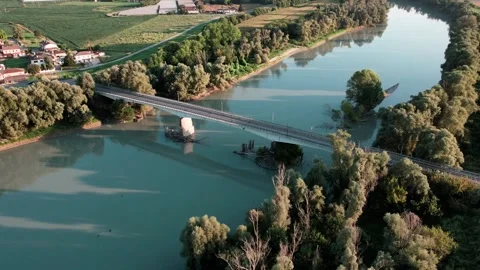 A time lapse shot by drone of a bridge spanning a river. Stock Footage 289231758