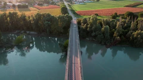 A time lapse shot by drone of a bridge spanning a river. Stock Footage 289231766