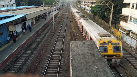 Time-lapse shot of EMU trains passing near a suburban railway station Stock Footage 109634867