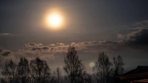 Time lapse shot of full moon traveling in the night skies Stock Footage