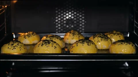 Time lapse shot. Hamburger bread cooking in the oven Stock Footage 132276789