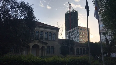 Time Lapse Shot of Historical Building Against Skyscraper Construction Site Video stock 101480253