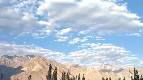 Time lapse shot of Huge mountains with blue sky and clouds Stock Footage 161428093
