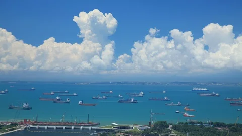 Time Lapse shot of hundreds of cargo ships anchored off the coast of Singapore. Video stock 115951539