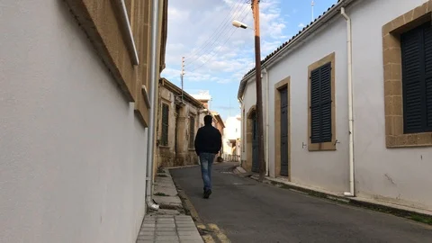 Time lapse Shot of a Man Walking by Narrow old Street Stock Footage 100470515