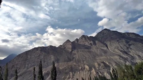 Time lapse shot of moving clouds over High Mountain Stock Footage 161428103