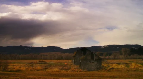 Time-lapse shot of old barn and cloudscape. Stock Footage 52322750