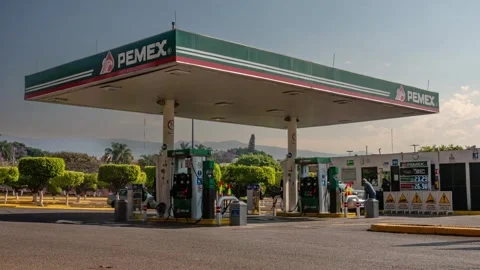 Time Lapse Shot of PEMEX Gas Station with Fuel Pumps in Urban Area Stock Footage 333864788