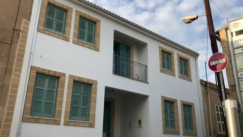 Time lapse Shot of People Pass by Vintage House in Nicosia Stock Footage 100470802