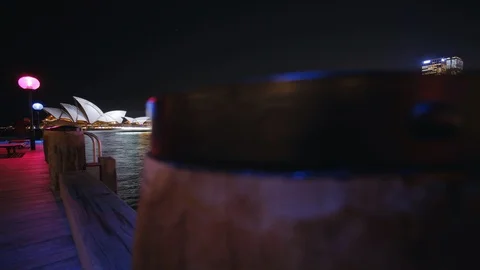 Time lapse shot pulling away from Sydney Opera House, night Stock Footage 99289223