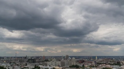 Time lapse shot of rainy clouds over the city. Static. 4K Stock Footage 77399575