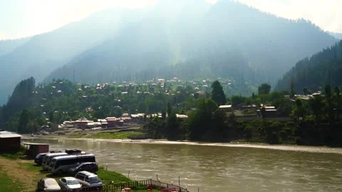 Time lapse shot of river with lush green mountains in hilly area of Pakistan Stock Footage 200758886