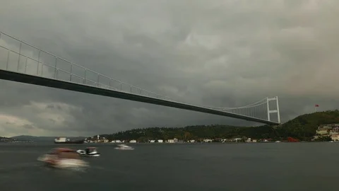 Time lapse shot of Second Bosphorus bridge, fishing boats run forth and back Stock Footage 84772821